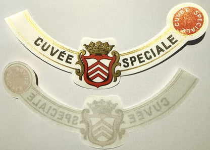 Antique French wine label with gilt-edged cream and black ribbons, red heraldic crest with crown, text reading "Cuvée Spécial
