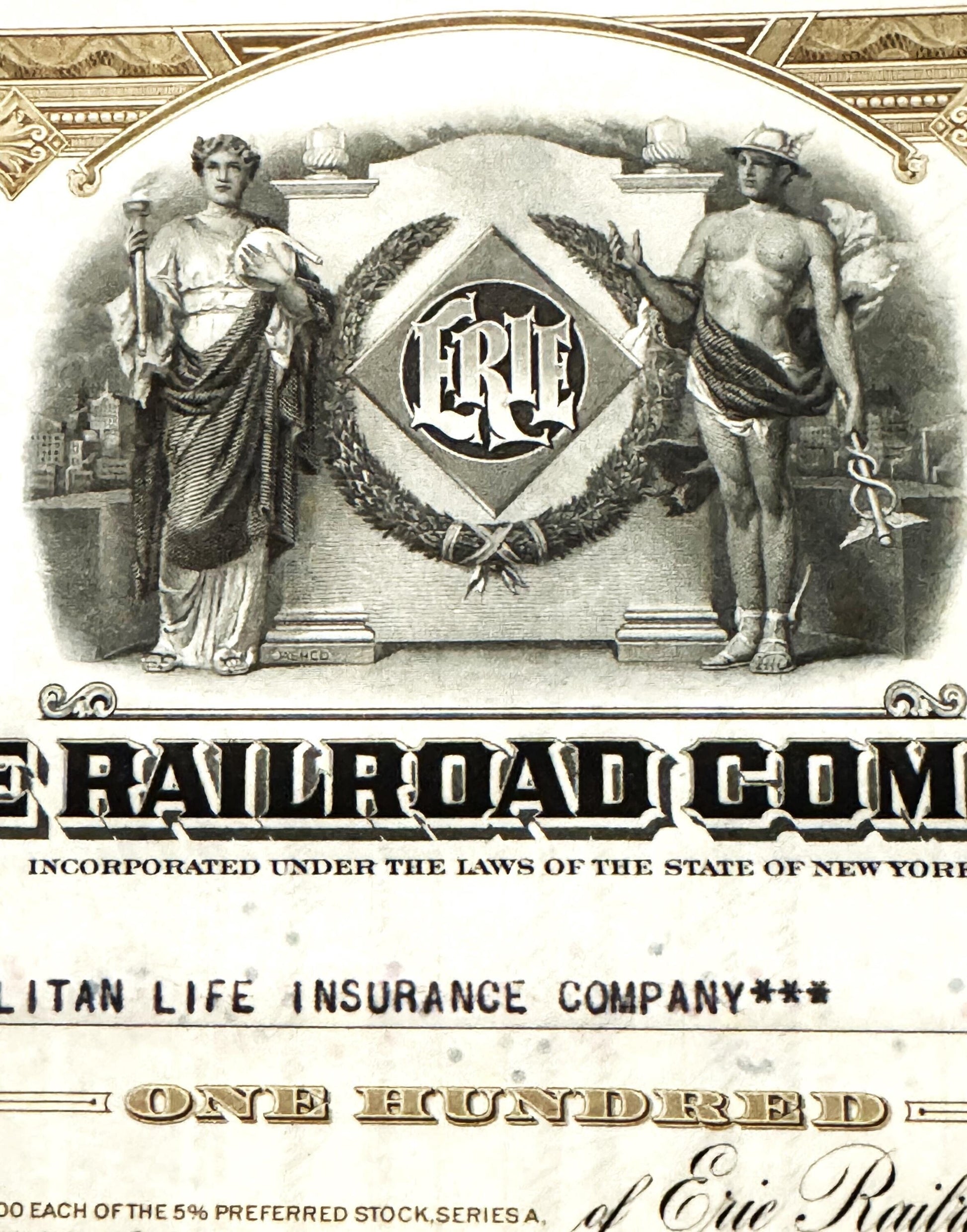 Vintage Erie Railroad stock certificate with ornate border, classical allegorical figures, and "ERE" monogram in diamond cent