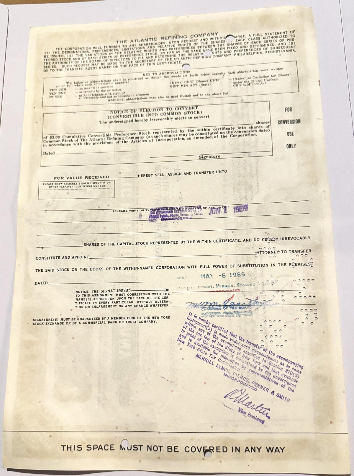 Vintage 1960s Atlantic Refining Company stock certificate with blue ink stamps and handwritten signatures on aged cream paper