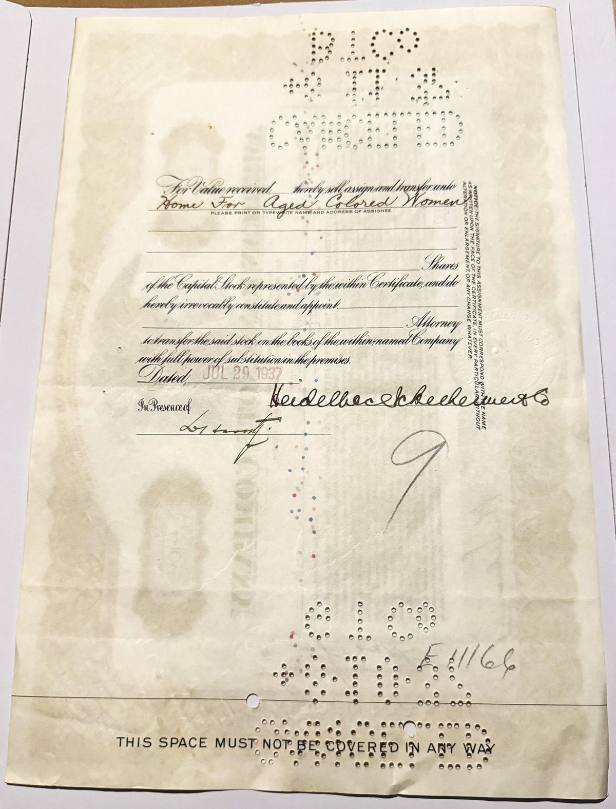 Aged stock certificate with handwritten signatures, printed text, and Braille characters on cream paper