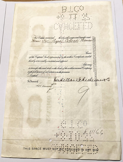 Aged stock certificate with handwritten signatures, printed text, and Braille characters on cream paper