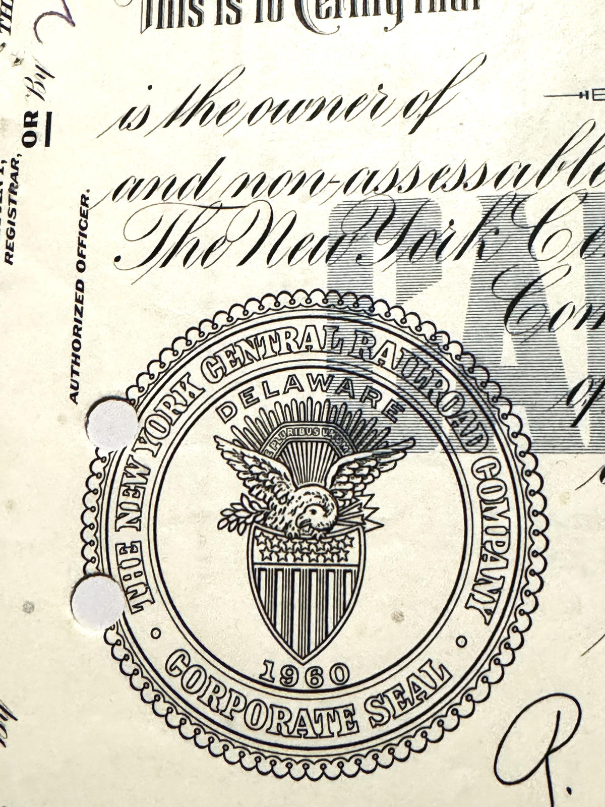 Vintage New York Central Railroad corporate seal from on stock certificate, showing eagle emblem and shield with vertica