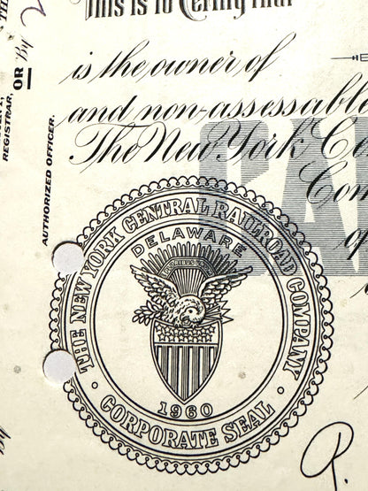 Vintage New York Central Railroad corporate seal from on stock certificate, showing eagle emblem and shield with vertica