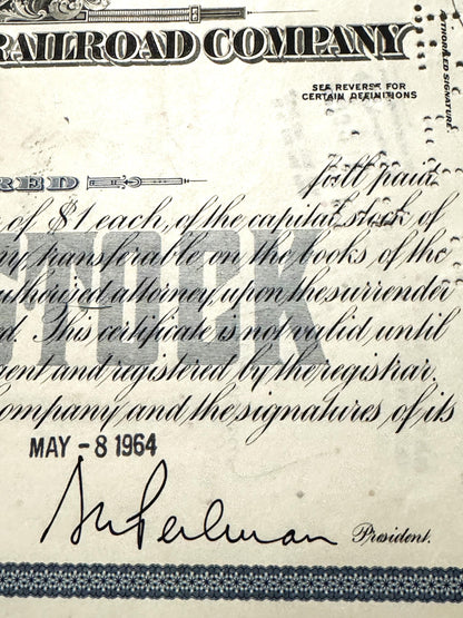 Vintage New York Central Railroad stock certificate with blue ornamental header, handwritten cursive text, and signature
