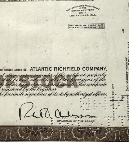 Vintage Atlantic Richfield Company stock certificate with brown decorative border and handwritten signature of Chairman of th