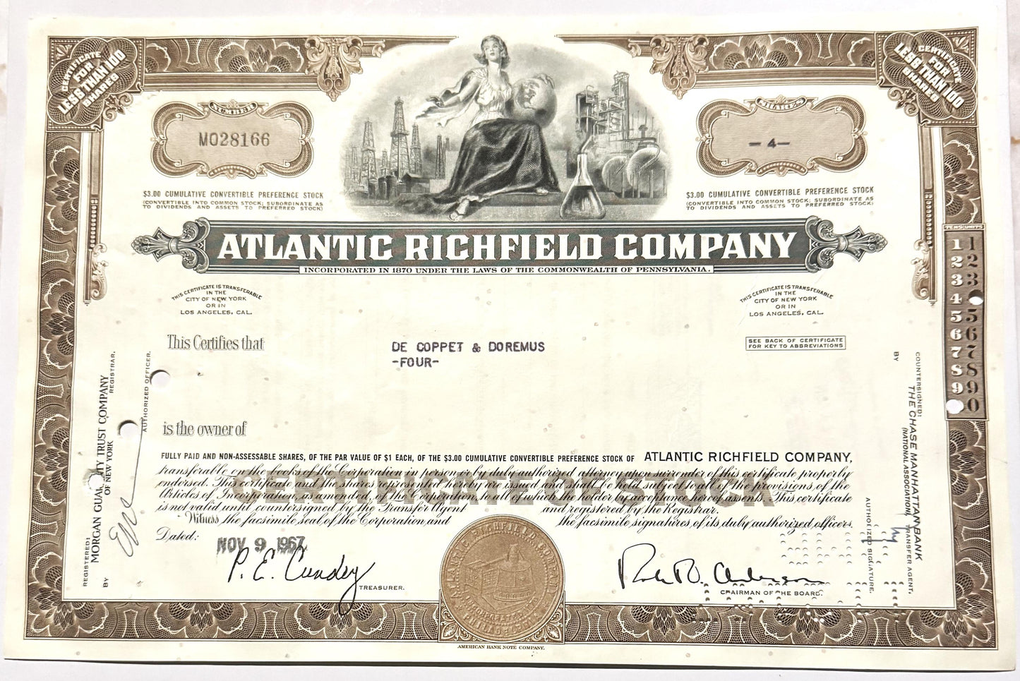 Vintage 1960s Atlantic Richfield Company stock certificate with ornate brown border, central allegorical engraving, and signa