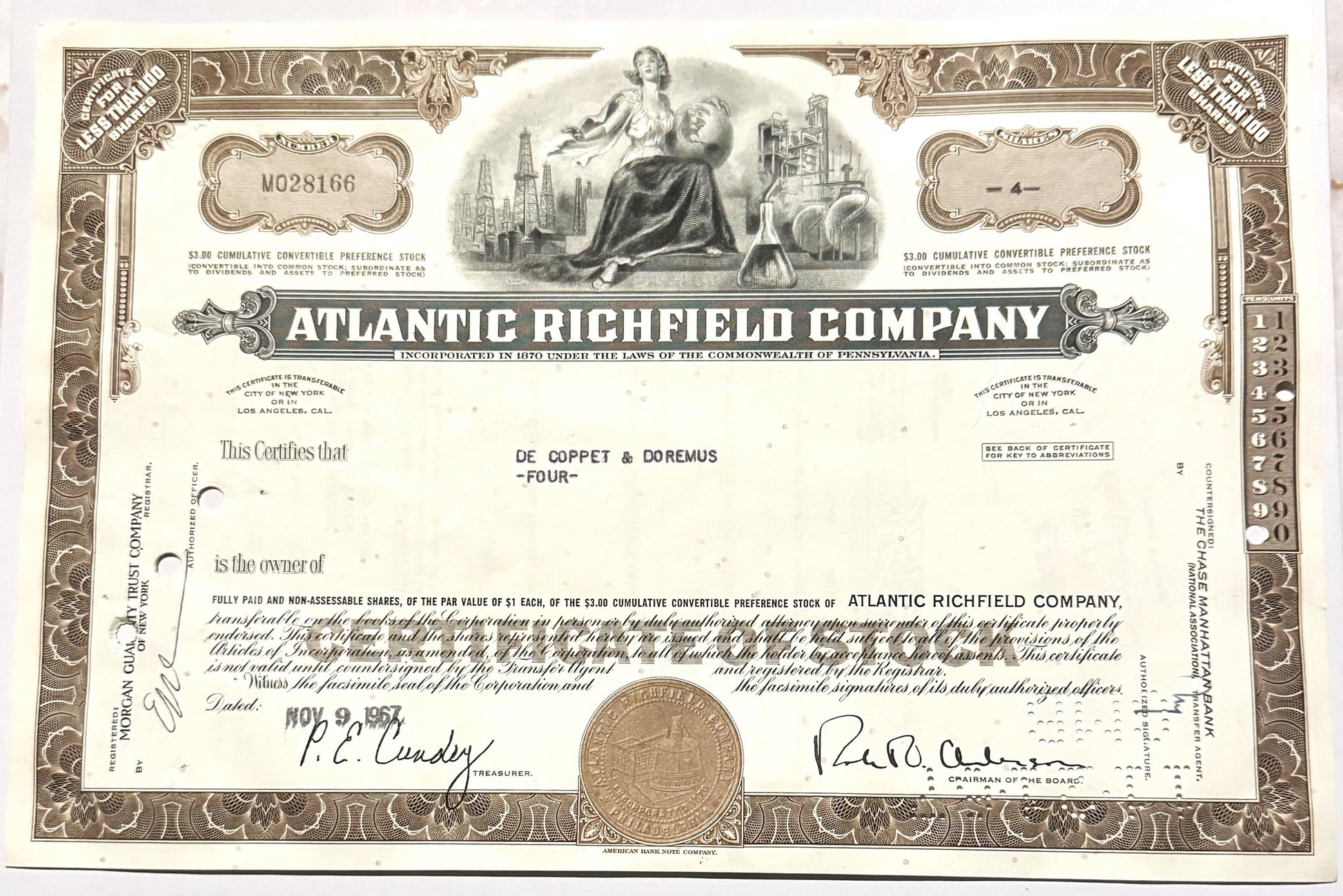 Vintage 1960s Atlantic Richfield Company stock certificate with ornate brown border, central allegorical engraving, and signa