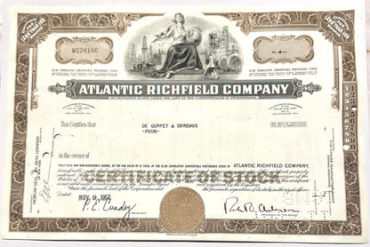 Vintage 1960s Atlantic Richfield Company stock certificate with ornate brown border, central allegorical engraving, and signa