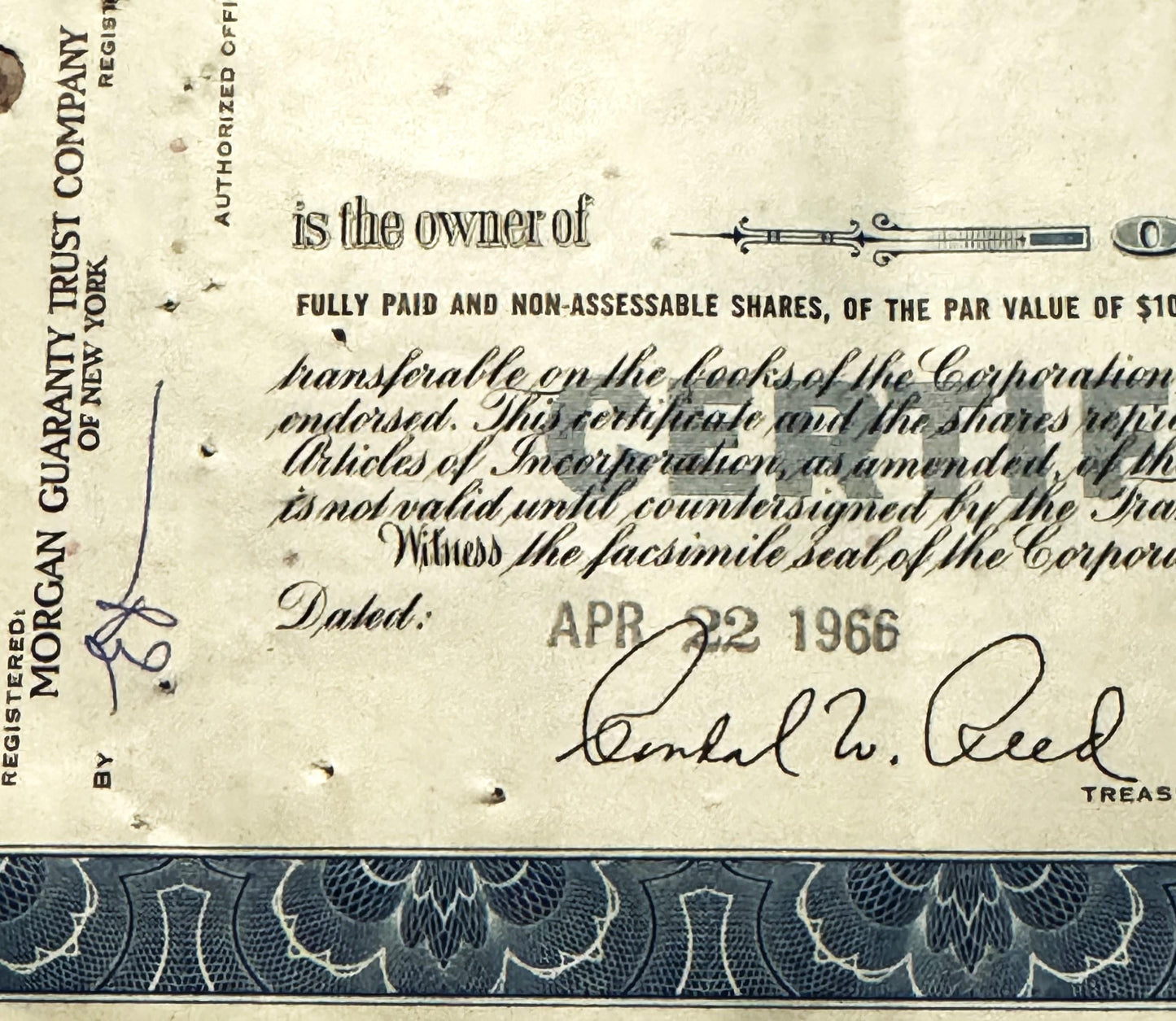 Closeup of Atlantic Refining Company stock certificate with ornate border, showing signature line dated APR 22 and