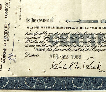 Closeup of Atlantic Refining Company stock certificate with ornate border, showing signature line dated APR 22 and