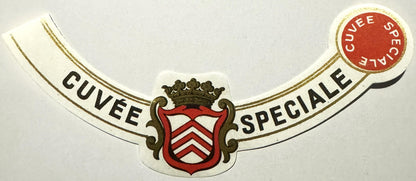 Antique French wine label with ornate heraldic crest, gold filigree borders, and "Cuvée Spéciale" text with red wax seal stam