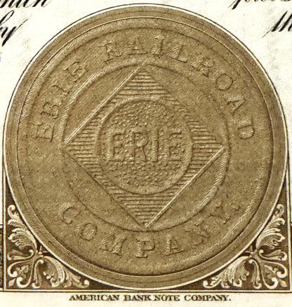 Close-up of an ornate coin or seal embossed on vintage paper, marked "American Bank Note Company" below, showing detailed shi