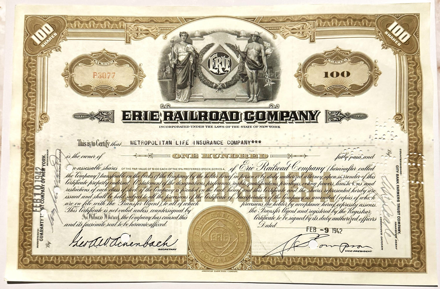 Ornate brown and cream stock certificate for 100 shares of Erie Railroad Company, with decorative bord