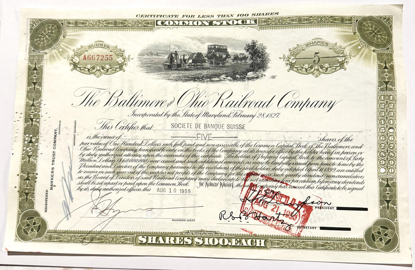 Vintage Baltimore and Ohio Railroad stock certificate for five shares, featuring green ornamental borders, steam locomotive e