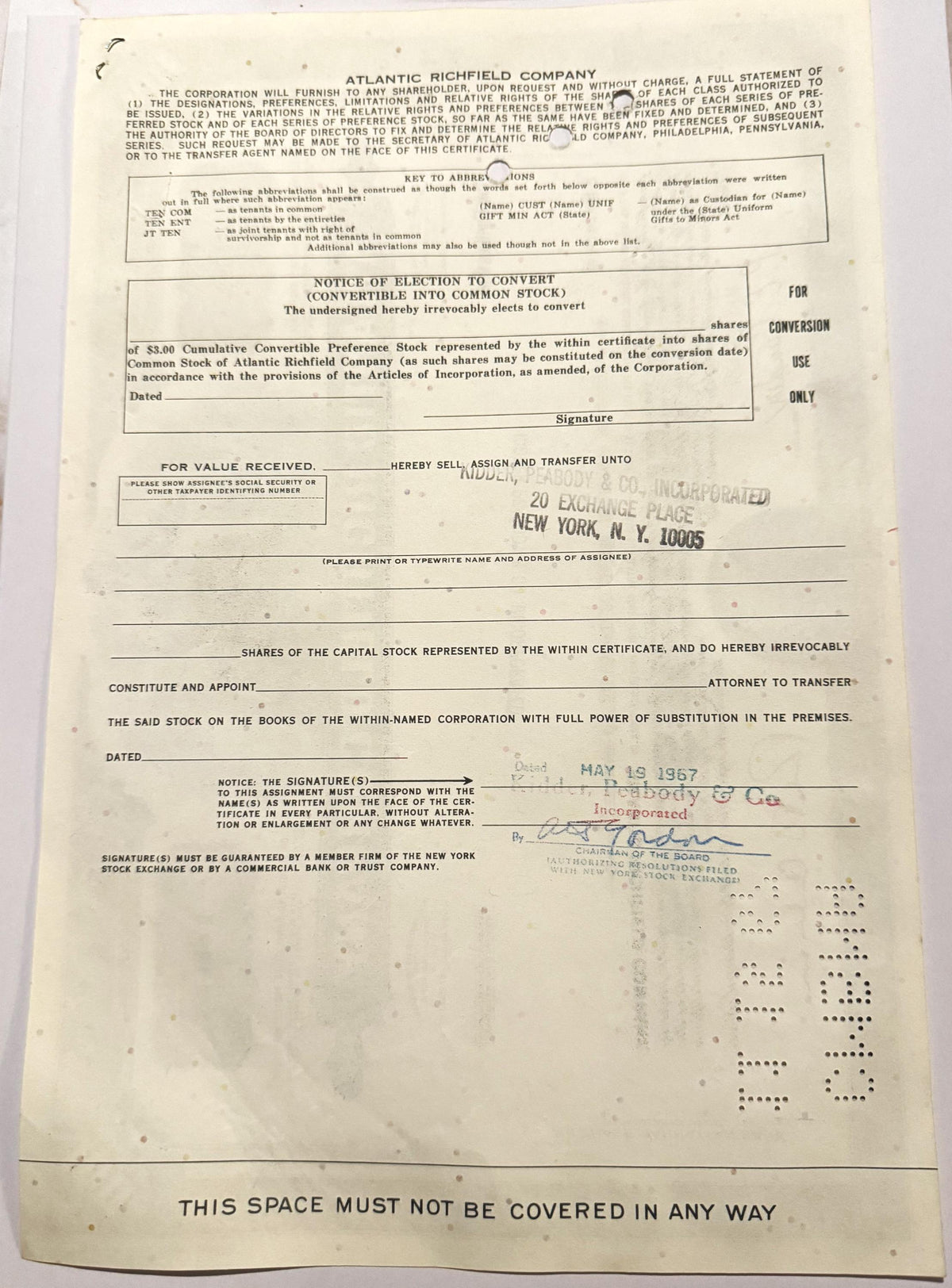 Vintage Atlantic Richfield Company stock certificate with printed text, conversion notice, and handwritten date stamp from Ma