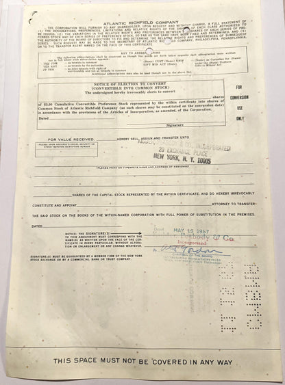 Vintage Atlantic Richfield Company stock certificate with printed text, conversion notice, and handwritten date stamp from Ma