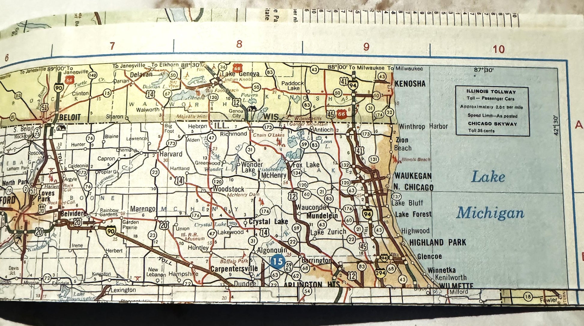 Vintage Illinois road map showing Route 66, towns, and Lake Michigan coastline, with ruler at top for scale