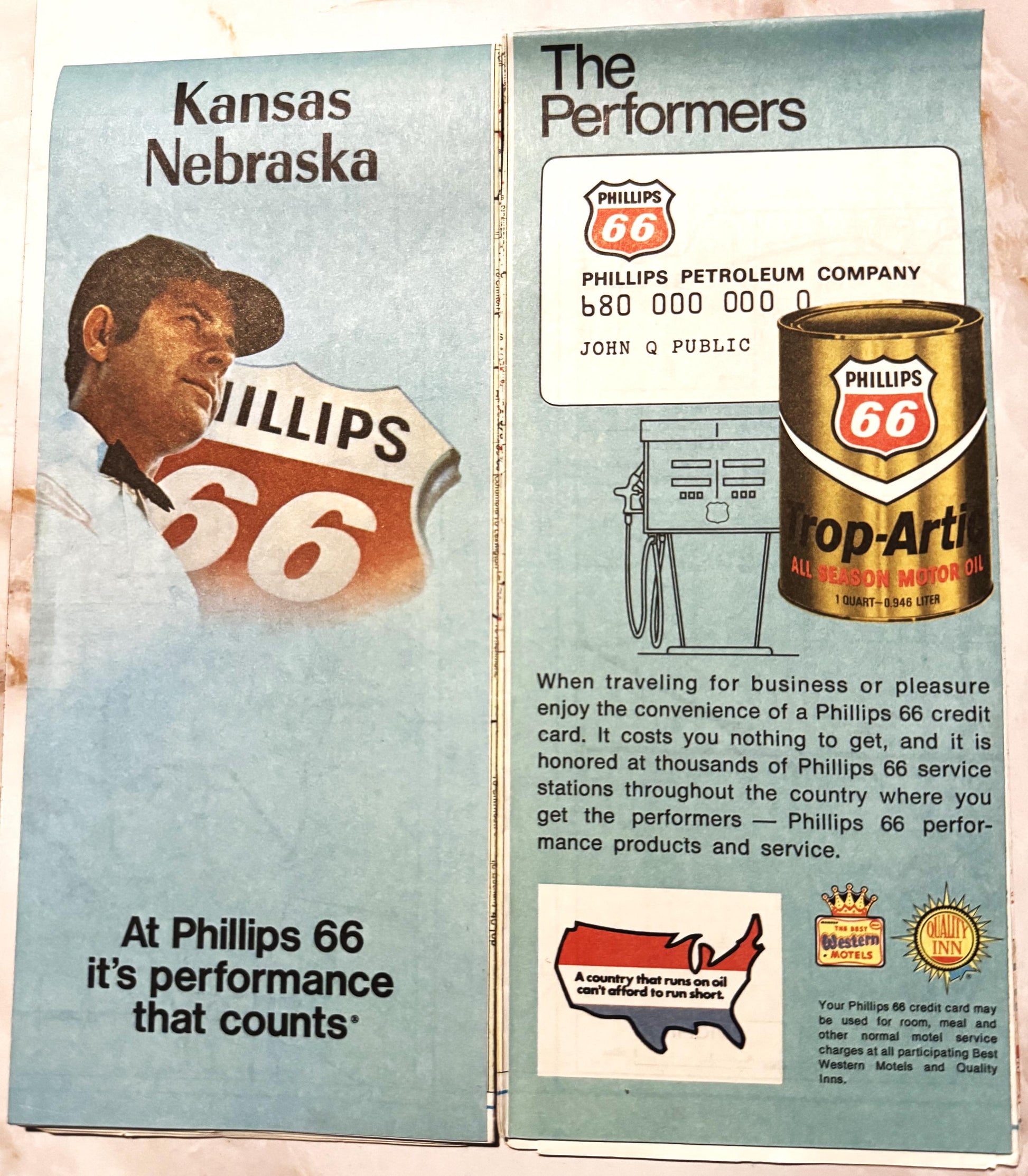 Open vintage Phillips 66 road map spread showing Kansas-Nebraska cover and promotional performers page with credit card, gas 