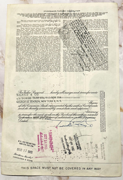 Studebaker-Packard Corporation stock certificate for 100 shares, cream-colored paper with black printed text and red stamps d