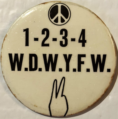Cream-colored vintage protest button pin with peace symbol at top, "1-2-3-4 W.D.W.Y.F.W." text, and peace hand gesture at bot