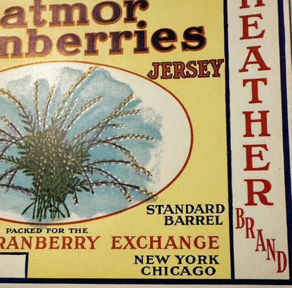 Vintage cranberry barrel label with yellow background, illustrated thistle plant, text reading "Eatmor Cranberries Jersey," "