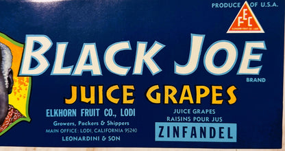 Vintage fruit crate label with "Black Joe Brand" juice grapes text on dark blue background, Elkhorn Fruit Co. Lodi California