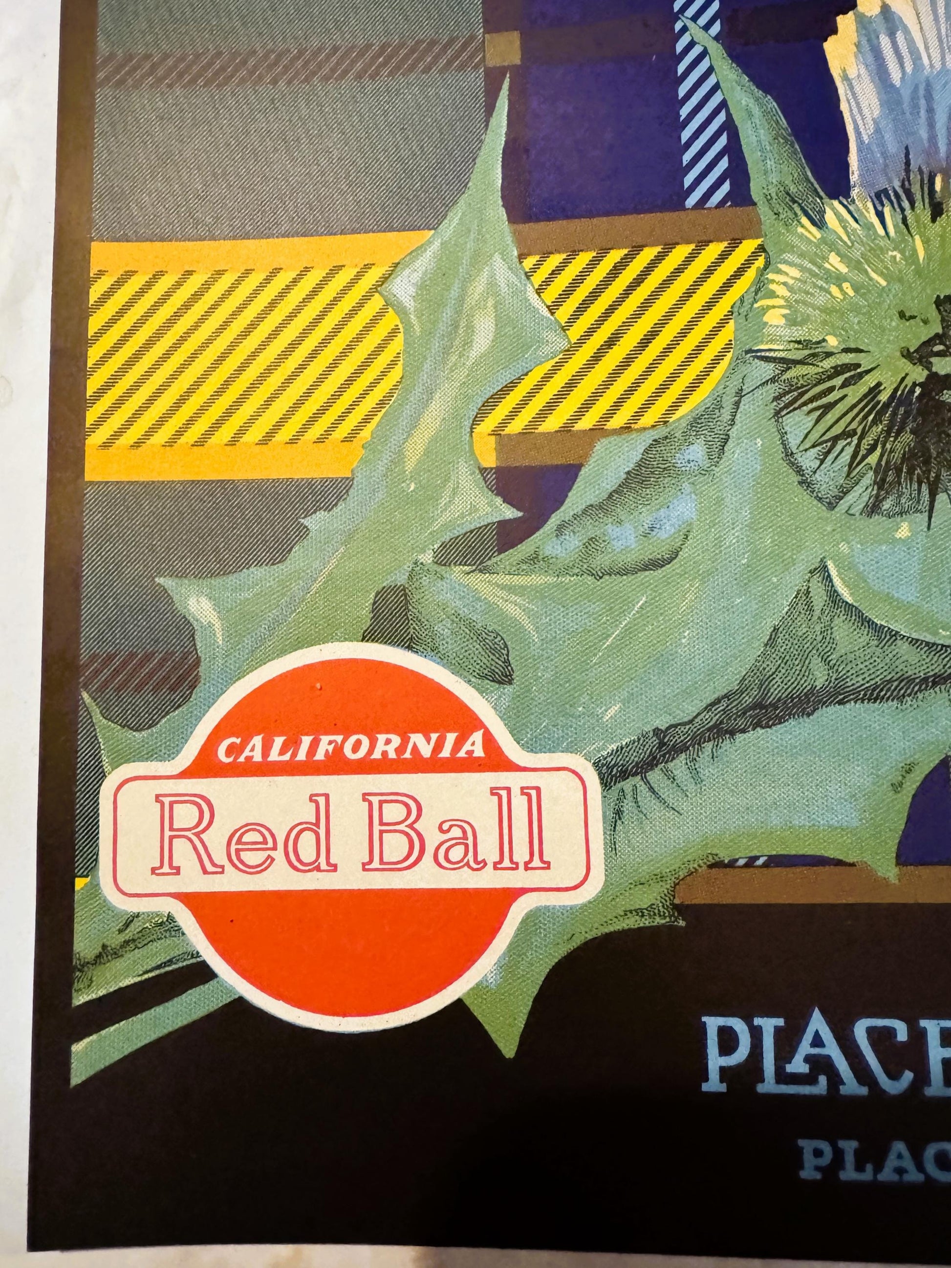Vintage orange crate label featuring red "California Red Ball" badge with green leafy design and yellow striped background, p