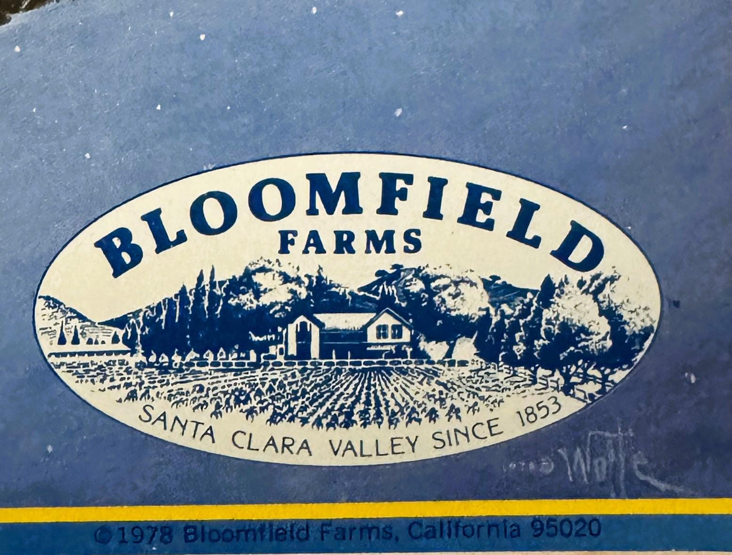 Vintage 1978 Bloomfield Farms firewood crate label with cream oval featuring ranch scene, mountains, and text "Santa Clara Va