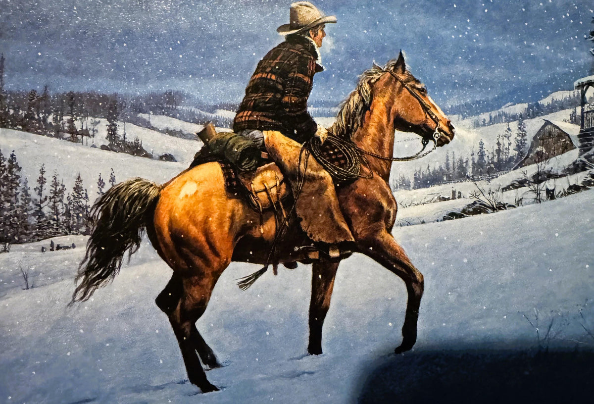 Cowboy on brown horse in snowy mountain landscape with cabin and evergreens, wearing plaid shirt and cowboy hat