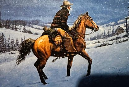Cowboy on brown horse in snowy mountain landscape with cabin and evergreens, wearing plaid shirt and cowboy hat