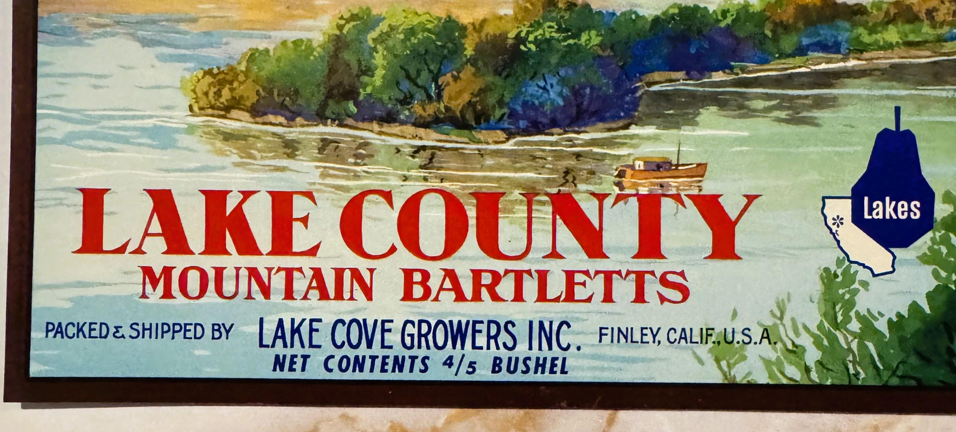 Vintage Lake County Mountain Bartletts crate label with red text, lake and forest watercolor scene, Lake Cove Growers Inc., F