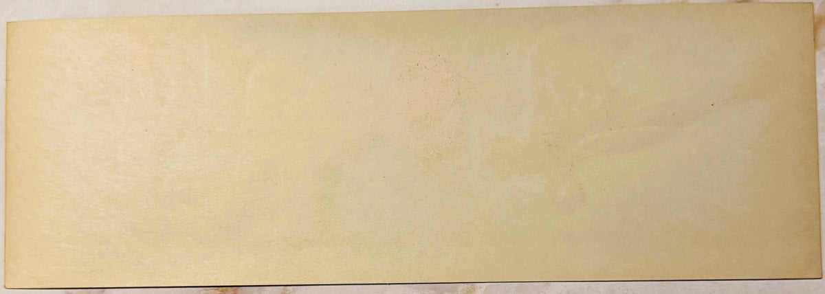 Blank cream-colored vintage citrus crate label with faint discoloration and aging marks, shown flat against neutral backgroun