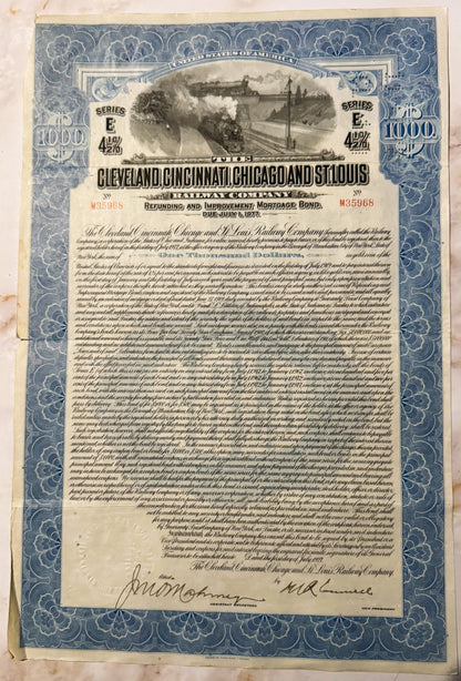 Vintage 1927 railroad bond certificate with blue ornamental border, steam locomotive vignette, and two signatures at bottom