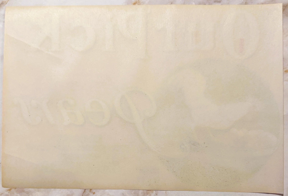 Back of the Our Pick Pears crate label: plain paper with Our Pick and Pears showing through faintly in reverse