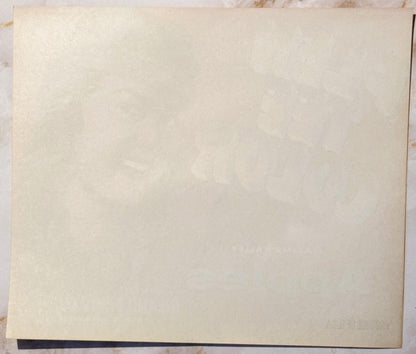 Blank cream-colored vintage fruit crate label with dark border, photographed flat against light background