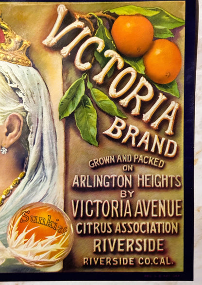 Vintage citrus crate label featuring "Victoria" brand oranges with ornate gold lettering, decorative woman's portrait, and Su