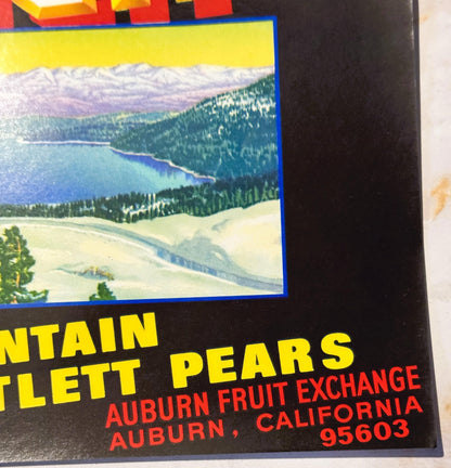 Vintage fruit crate label showing mountain lake landscape with yellow sky, blue border, yellow and red text for Donner Bartle