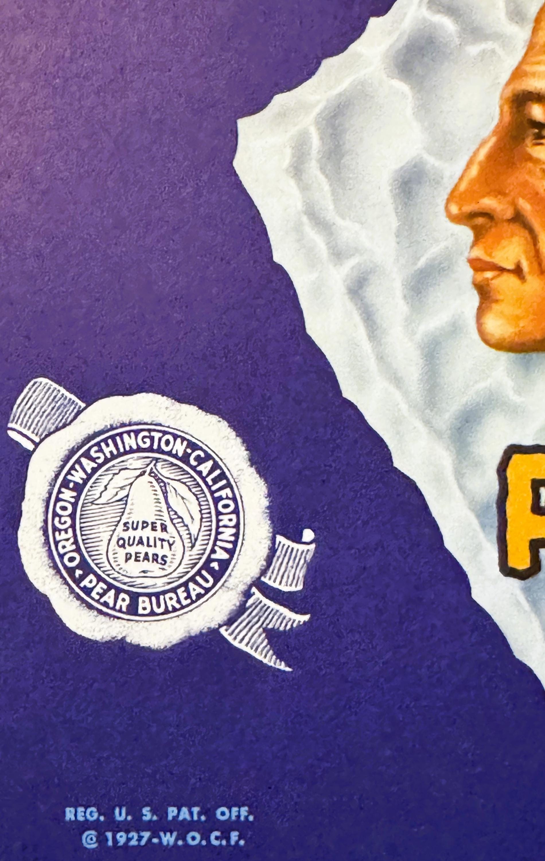 Vintage fruit crate label with purple background showing Native American chief profile, white clouds, Oregon-Washington Pear 