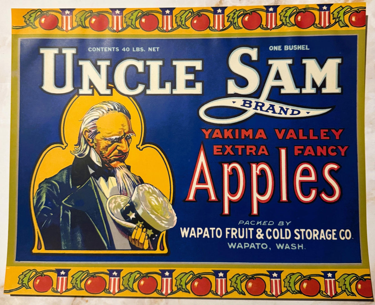 Vintage Uncle Sam Brand apple crate label with bearded Uncle Sam holding an apple, red and blue design with yellow border and