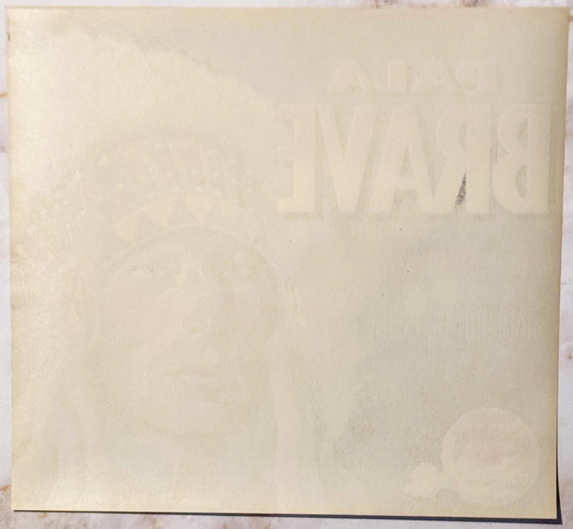 Blank cream-colored vintage crate label with faint watermark, shown flat against white background