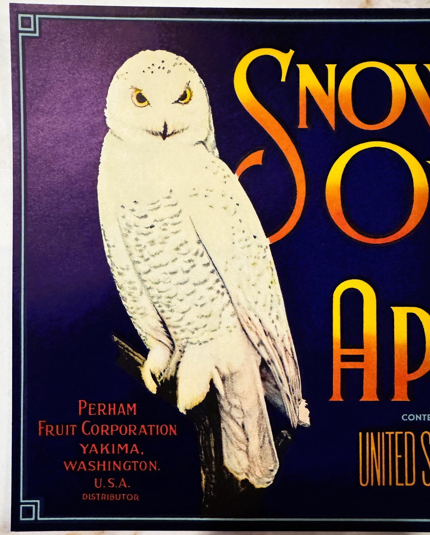 Vintage Snow Owl apple crate label featuring white snowy owl on dark blue background with yellow and orange text, Perham Frui