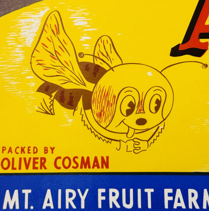Vintage bee crate label with smiling cartoon bee character, yellow background, red and brown accents, text reading "Packed by