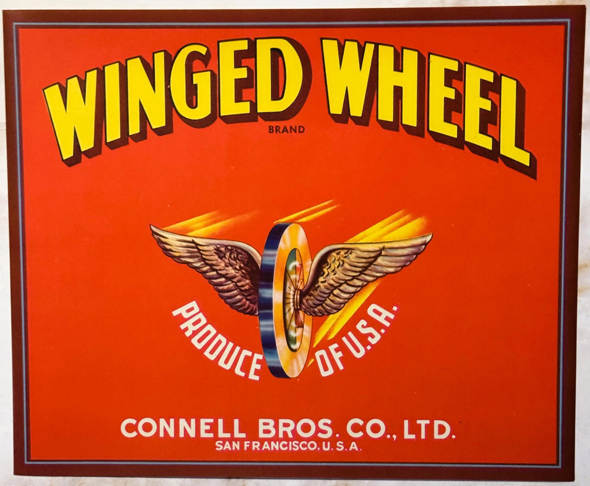 Vintage Winged Wheel Brand crate label with yellow lettering on red background, winged wheel logo, "Produce of U.S.A." text, 
