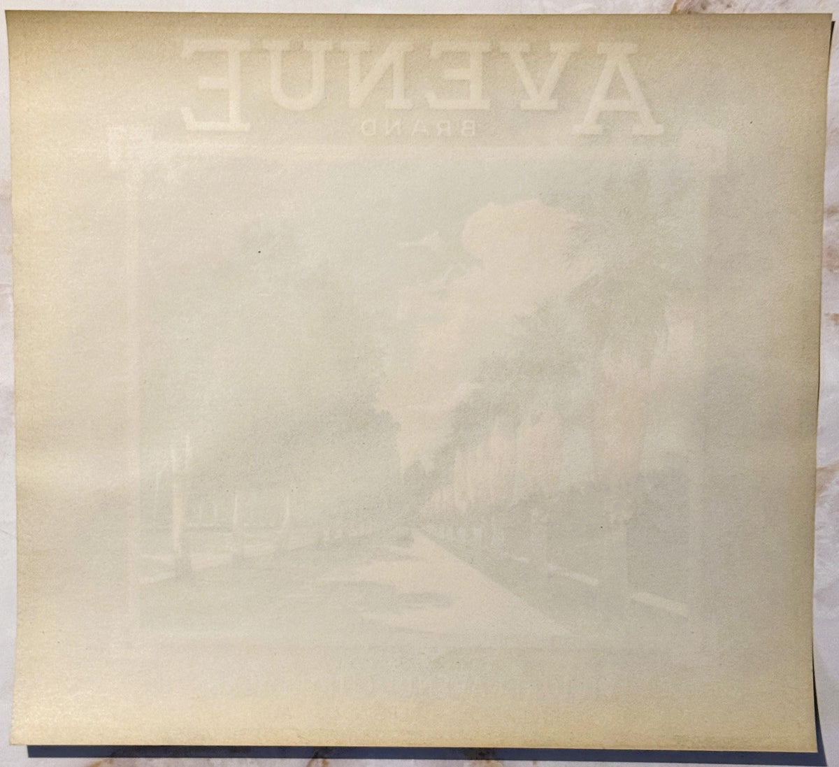 Faded cream-colored citrus crate label with embossed "FUDEYA" text visible at top, showing age and wear