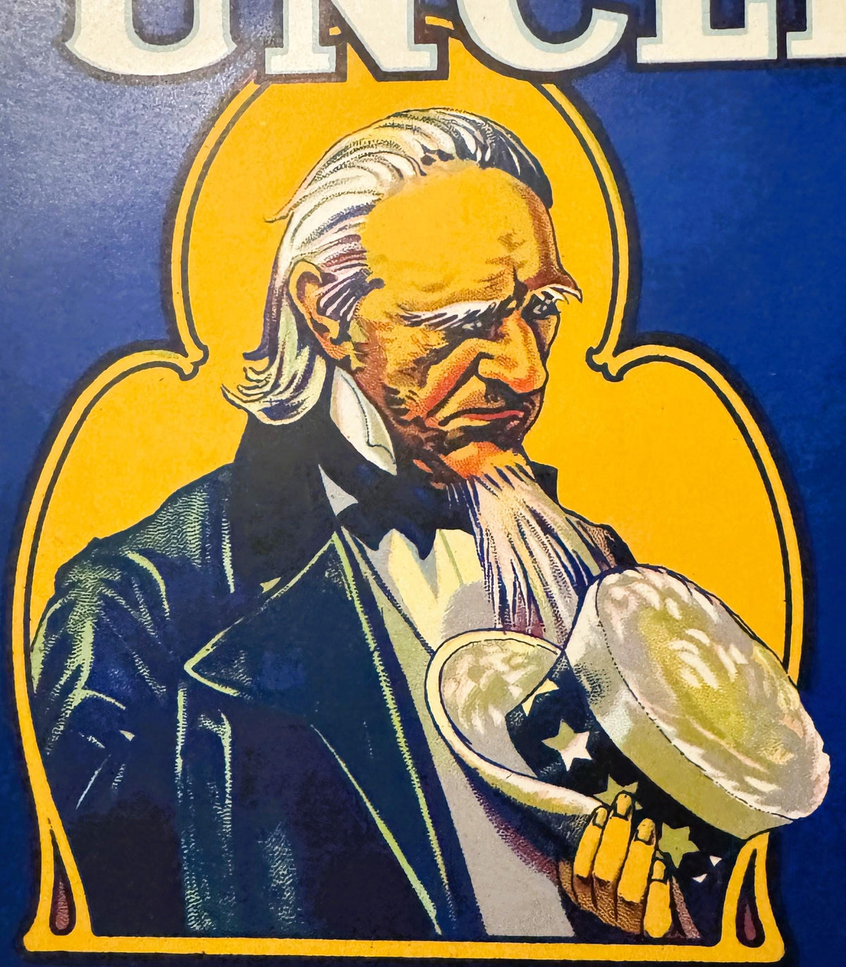 Vintage fruit crate label featuring an elderly man in blue jacket with white hair holding a large apple against yellow backgr