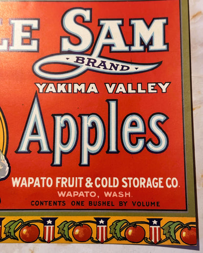 Vintage red fruit crate label for Uncle Sam Brand Yakima Valley Apples from Wapato Fruit & Cold Storage Co., Wapato, Washingt