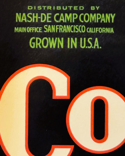Vintage crate label with lime green text on black background and large red-outlined letters reading "CO" at bottom, distribut
