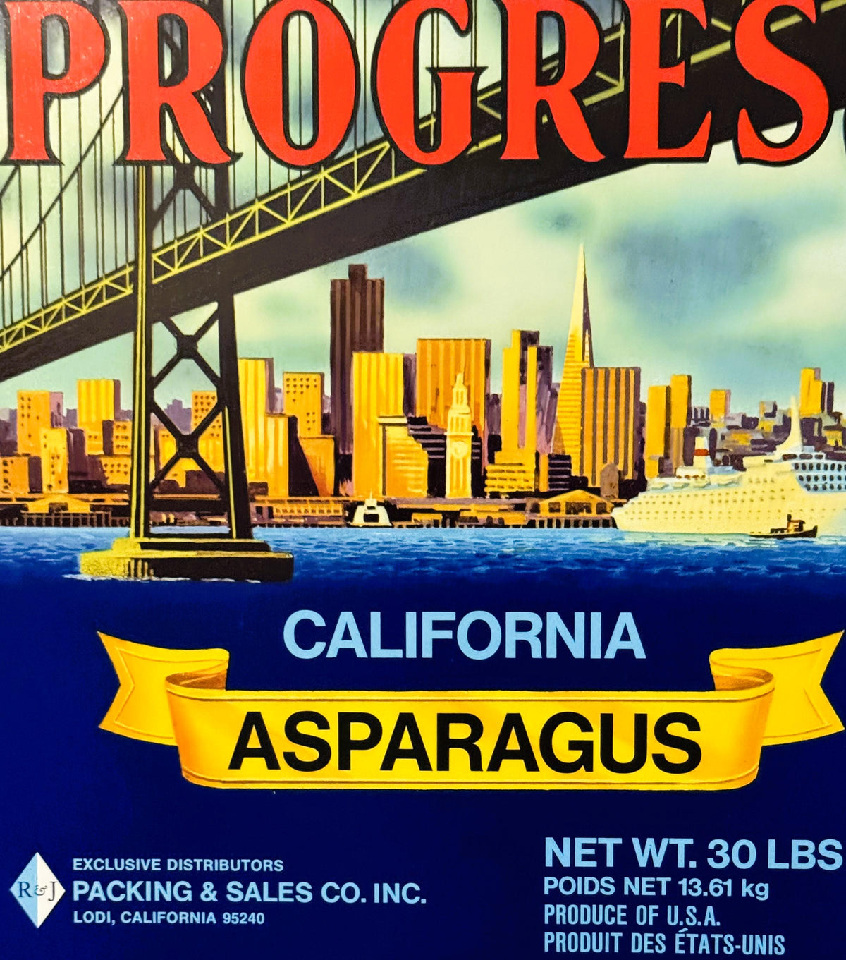 Vintage Progress brand California asparagus crate label featuring San Francisco skyline and Bay Bridge in art deco style, bil