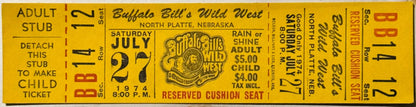 Yellow vintage ticket stub for Buffalo Bill's Wild West show, July 27, 1974, North Platte Nebraska, with red and black