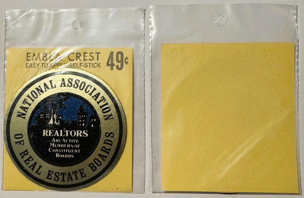Vintage self-stick emblem decal priced 49¢, showing National Association of Real Estate Boards circular seal on yellow backin